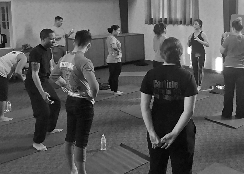 Gentle yoga guest instruction at air force base